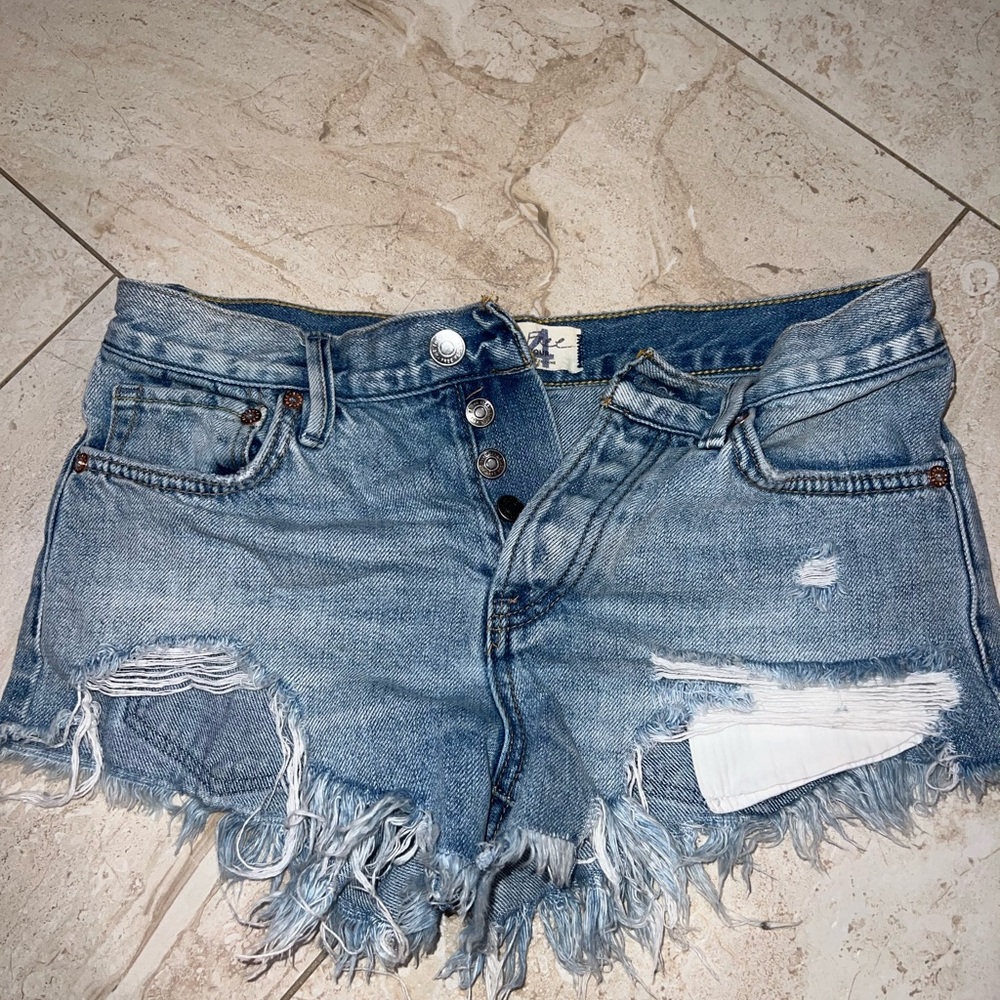 Free people denim distressed shorts button fly.